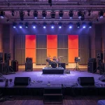 A high-quality photo of a well-organized event setup with clean acoustics.